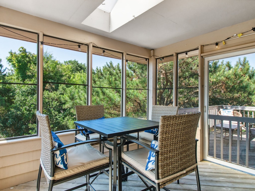 Enjoy al fresco dining out on the Screened-In Porch.