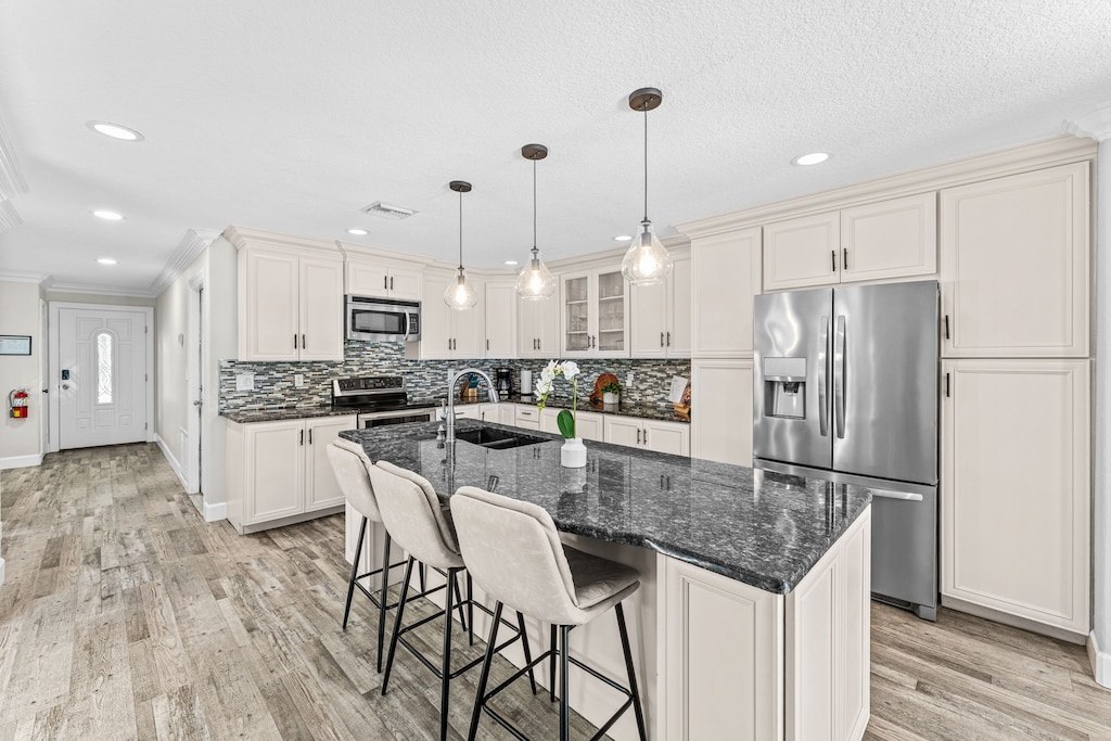 Sleek and modern kitchen with breakfast bar seats three