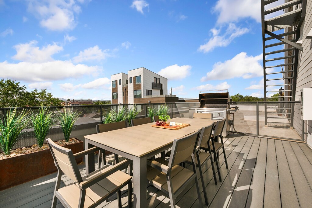 Common Area | Rooftop Balcony with Outdoor Seating, Grill, and Mountain Views!