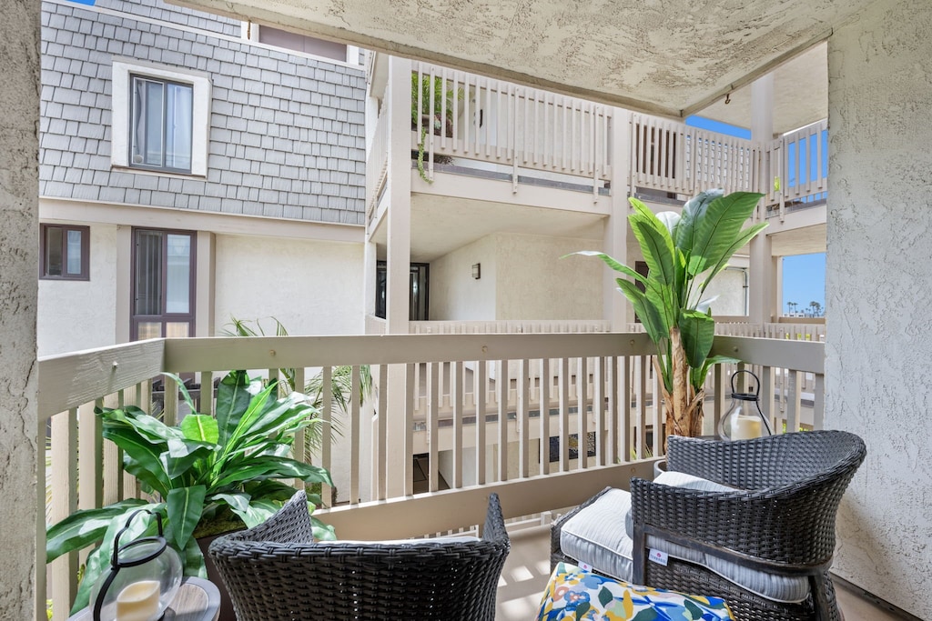 Enjoy a cozy interior condo with a charming peekaboo view of the harbor — just enough to remind you the sea is near.