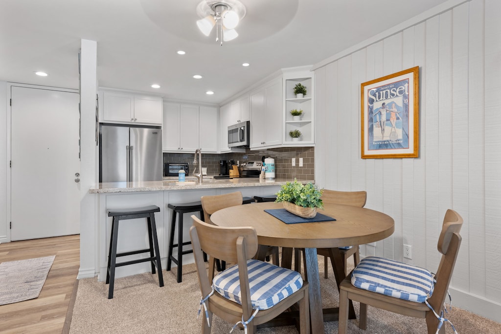 Gather around the charming wooden table for cozy family dinners, lively game nights, and unforgettable shared moments.