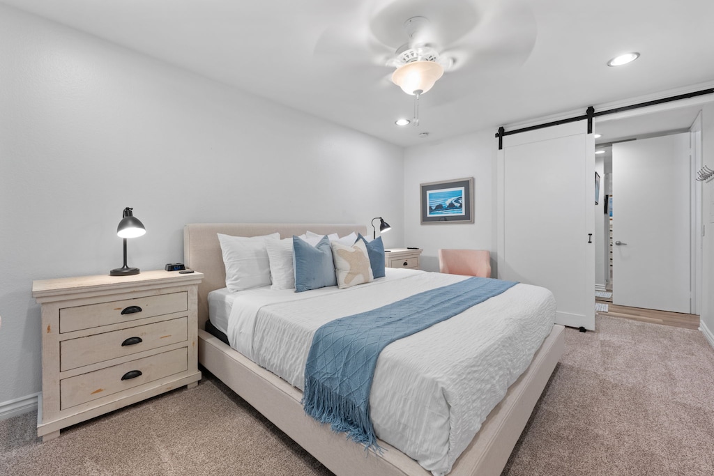 Drift off in the elegant primary bedroom, featuring a fresh new mattress and contemporary headboard, both added in June 2025 to enhance your stay.