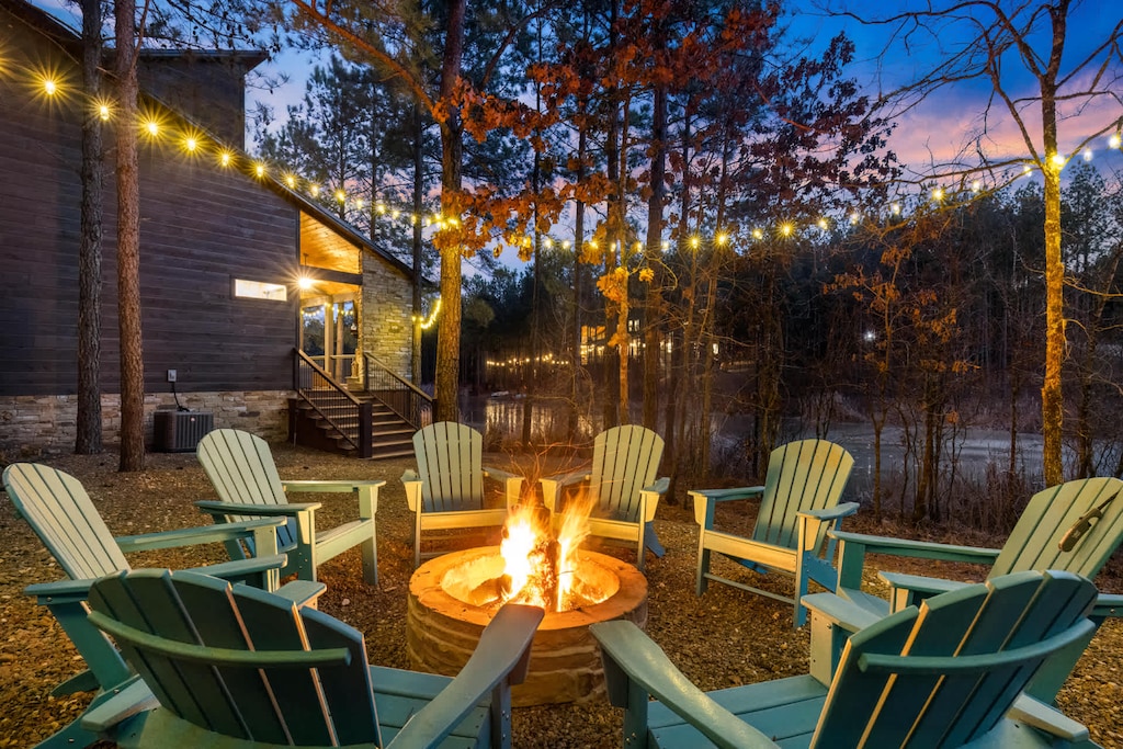 Cozy up by the campfire under a canopy of autumn leaves! Gather 'round our crackling fire pit, perfect for sharing stories, roasting marshmallows, and soaking in the crisp air of the woods. Your unforgettable fall getaway starts here.