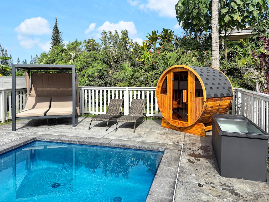 Unwind in your private outdoor oasis with pool,spa, sauna, cold plunge and shaded daybed .