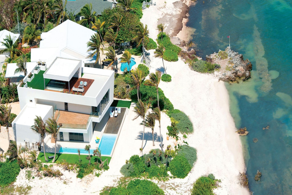 Welcome to Olympus, a 5-bedroom designer home in beautiful Rum Point.