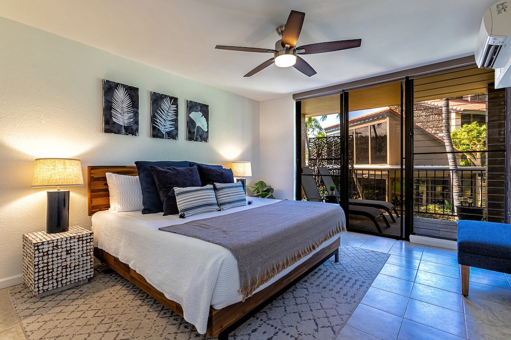 Primary bedroom has a king size bed with access to the lanai.