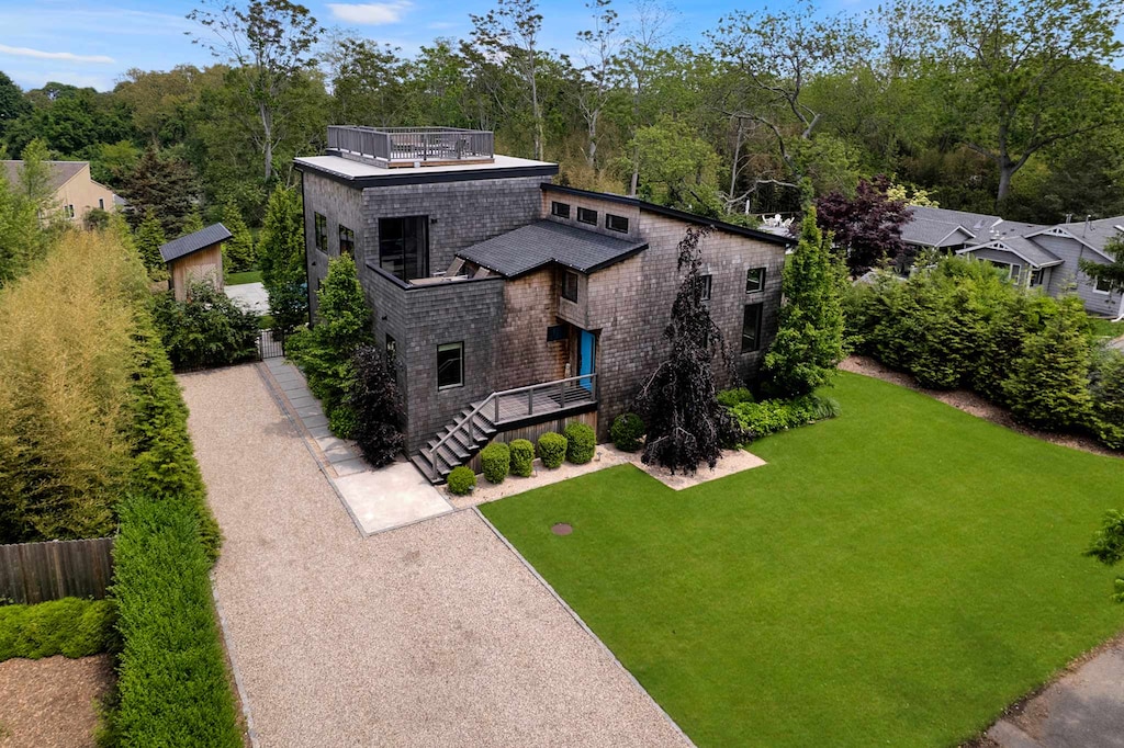 Modern retreat surrounded by lush greenery.