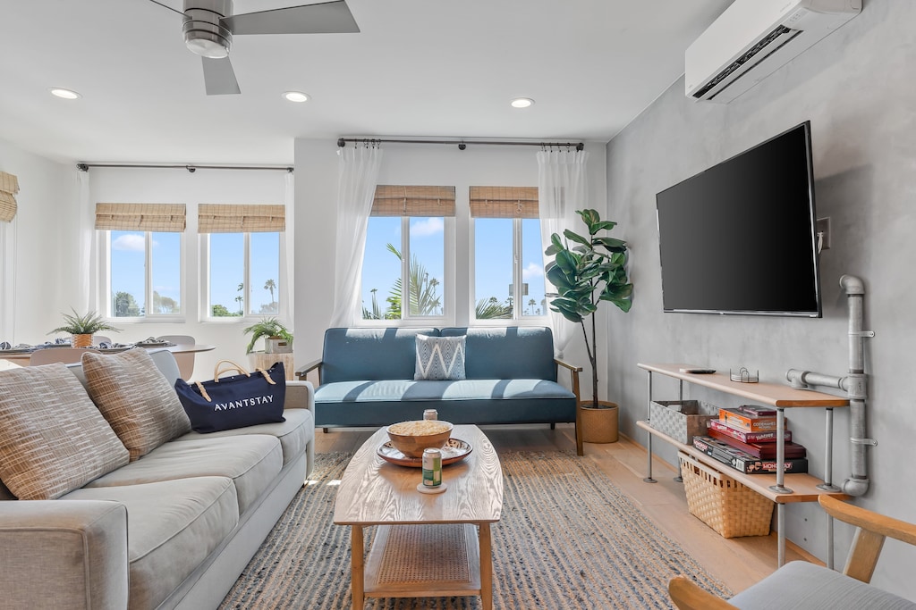 Stylish living room with comfy seating and natural light.