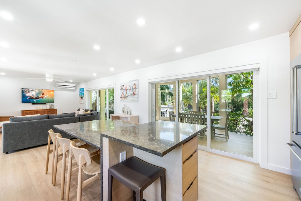 The lower level living areas feature walk-out access to the screened atrium.