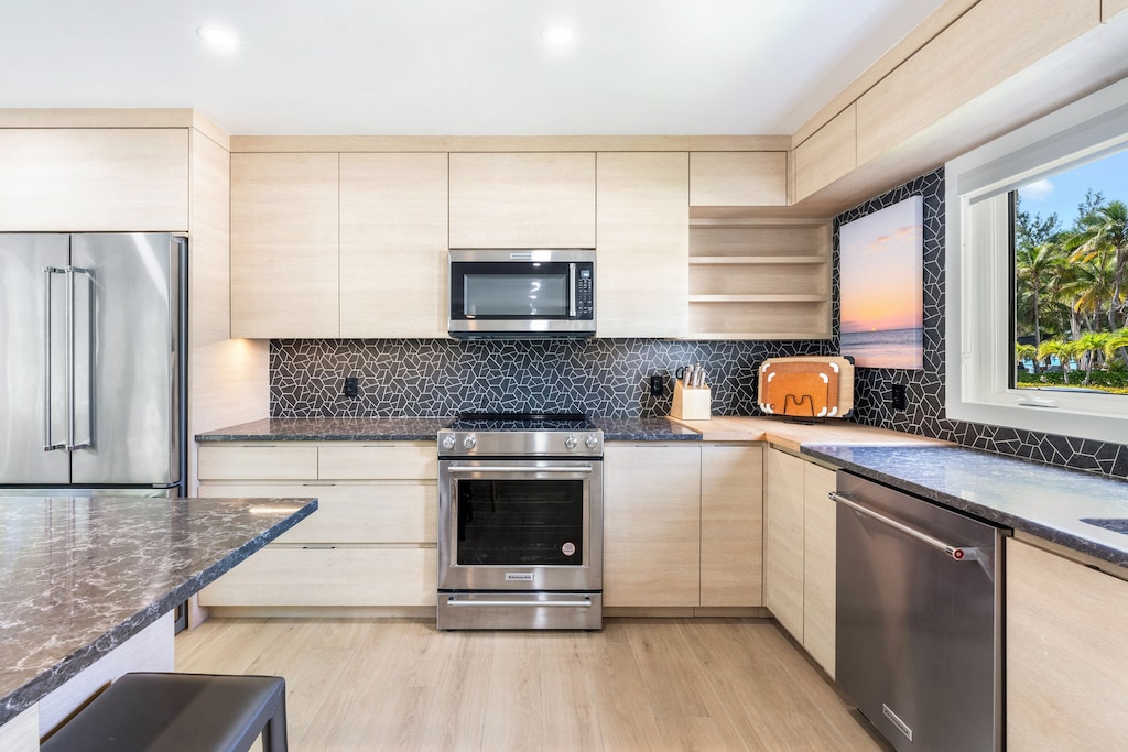 Full kitchen with modern appliances.
