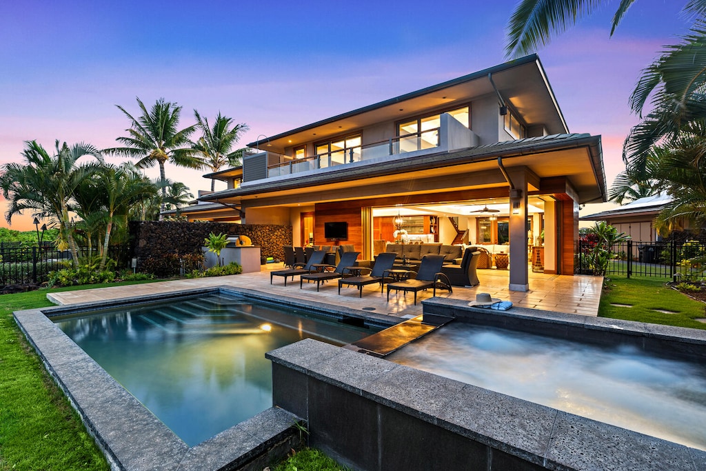 Sunset over your private pool and spa at this luxury island escape.