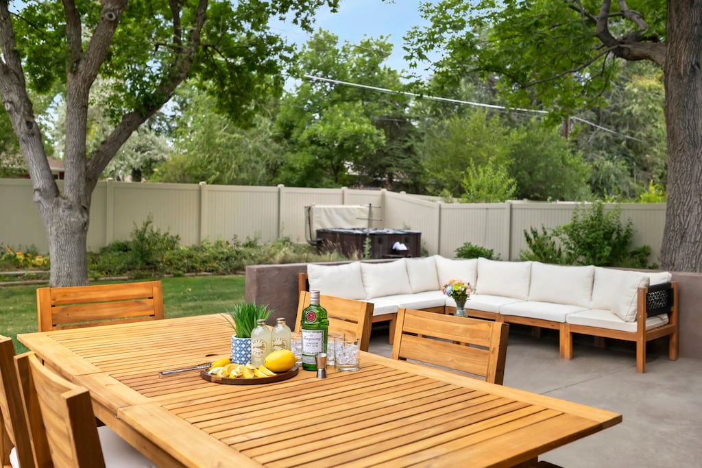 Backyard with Private Hot Tub, Lounge Seating, and Outdoor Dining Table