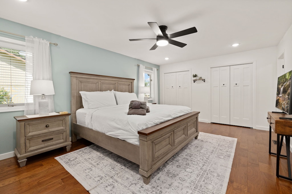 Primary bedroom - King size bed, Smart TV, closet, and an attached private bathroom.