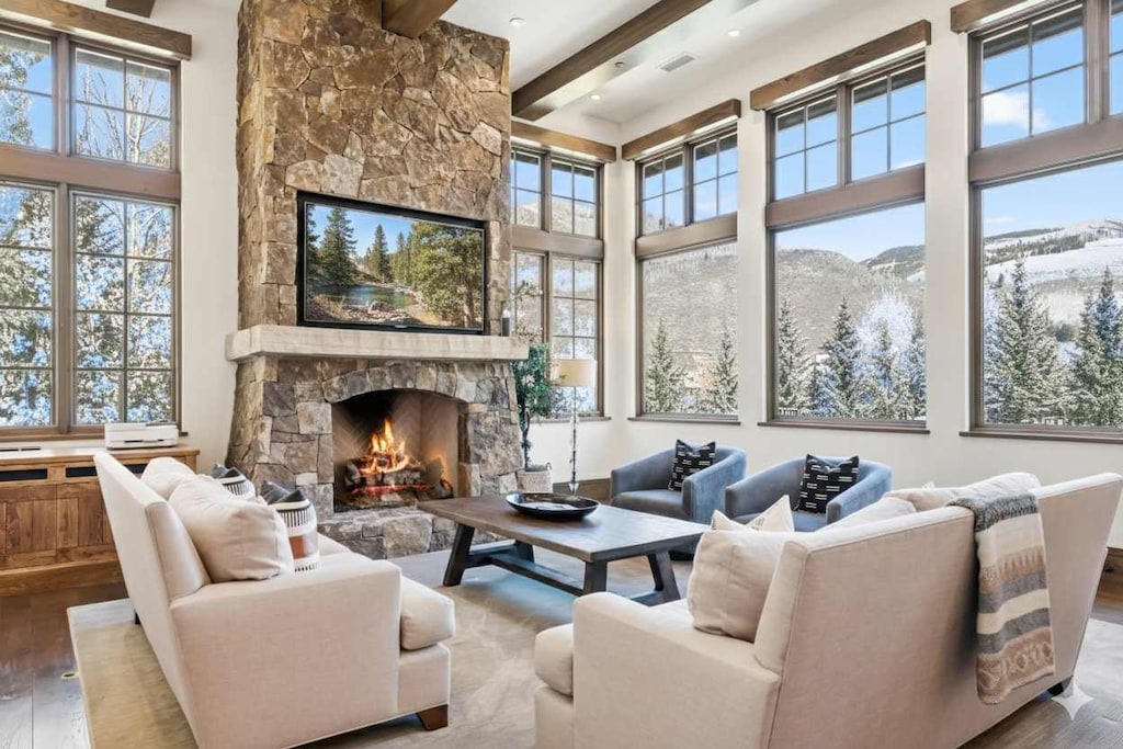 Living room 1: Main floor, gas fireplace, Smart TV, mountain views, balcony access