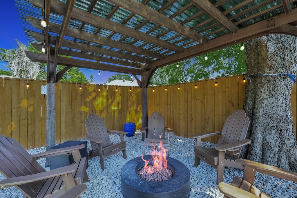 Gather around this enchanting fire pit as you chat late into the night. The fire will keep you nice and warm while the twinkling string lights add ambiance to your night.