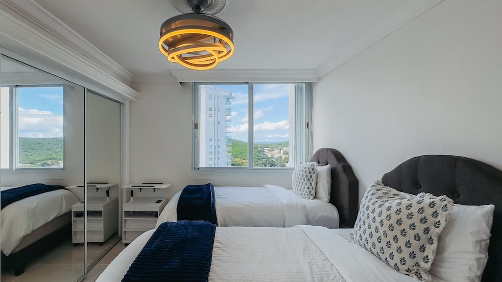 Mountain views from the second bedroom showcase a window to the ocean that we all fall in love with.