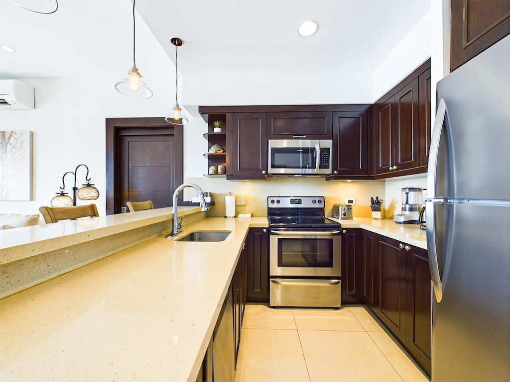 Open kitchen, stainless steel appliances