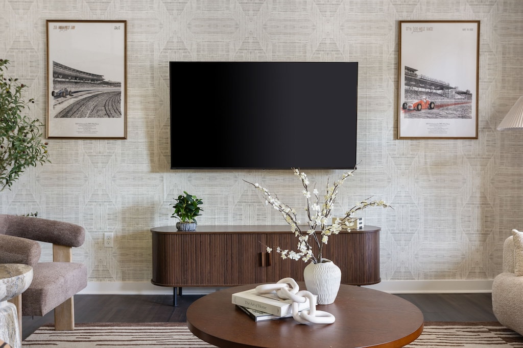 Step into our sleek and sophisticated living space with a touch of Indy flair.