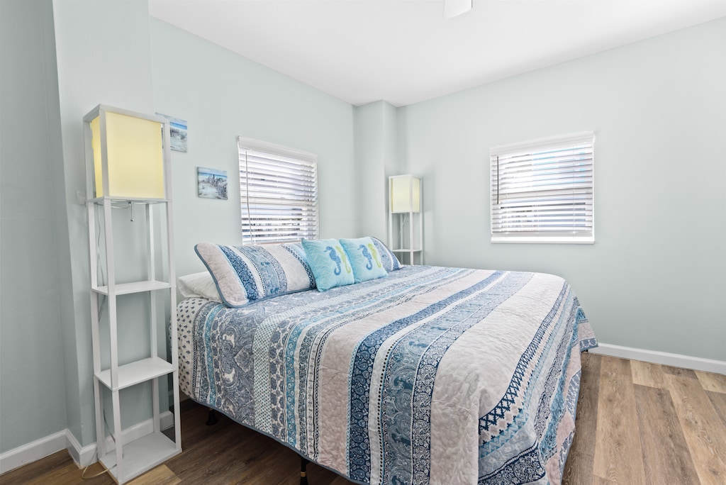 First floor guest bedroom 1 with queen bed