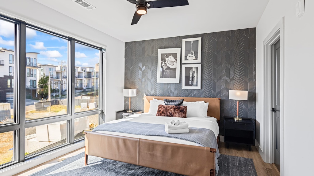 The primary bedroom features a king bed, TV and an ensuite bathroom.