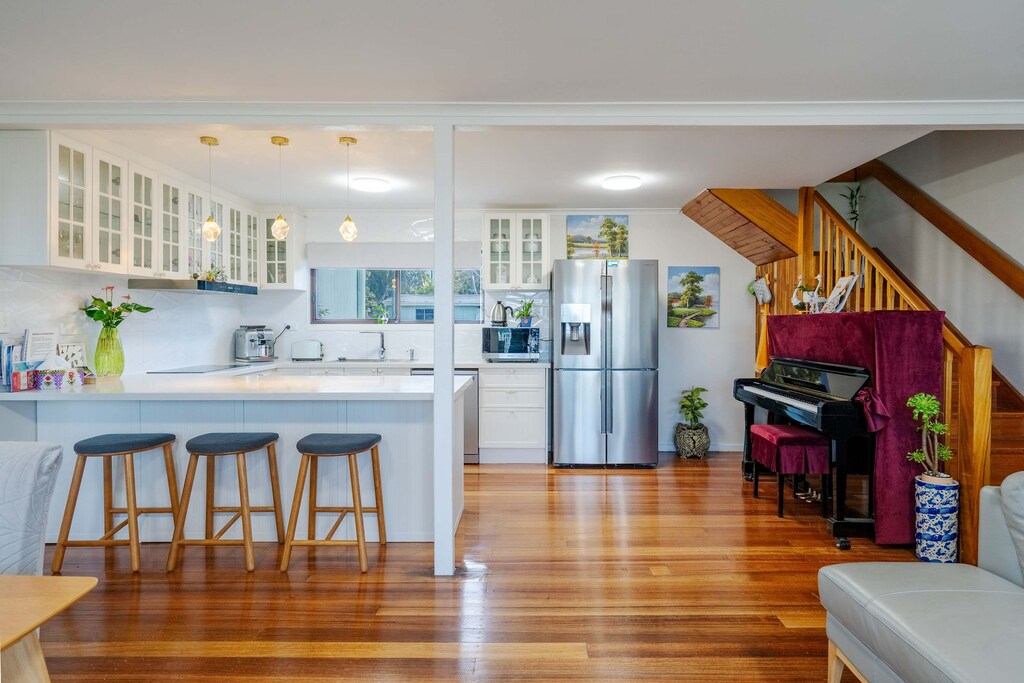 Bright and spacious living room with piano 