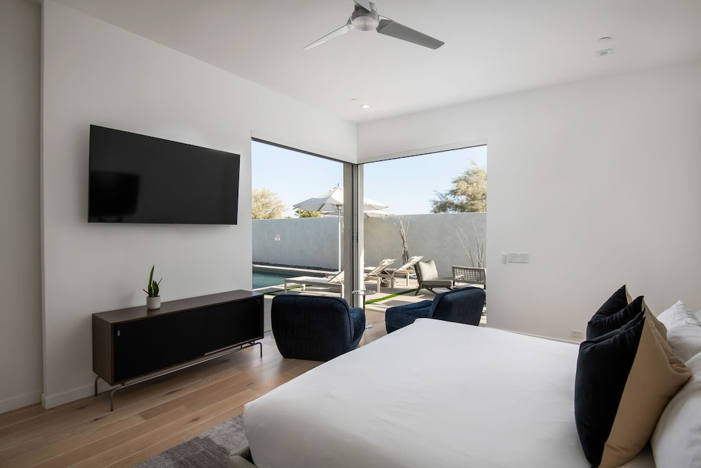 The Primary Suite's quiet reading nook offers an intimate view of the pool and immediate access to the sun deck.