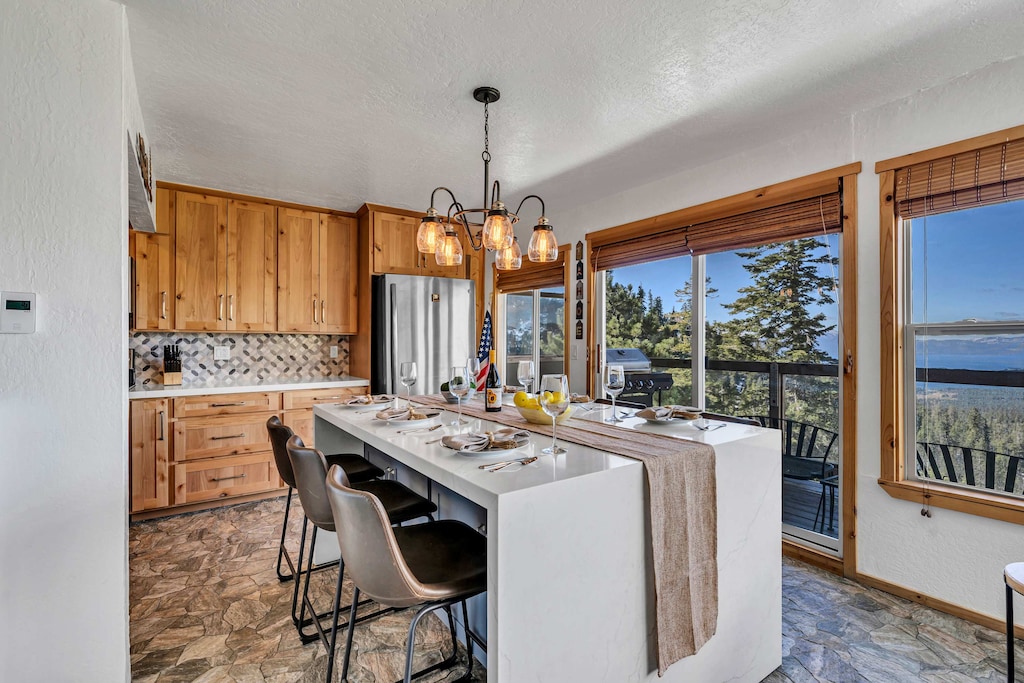Dining area: Kitchen island with 6 barstools, open to living room