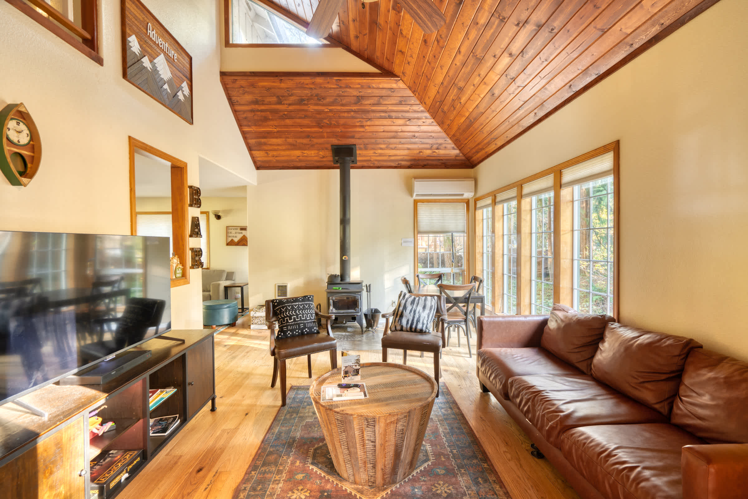 Living room with vaulted wood ceilings.