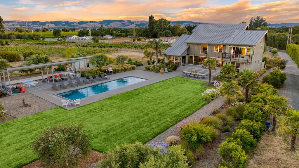 Boasting a luxurious pool and a backdrop of picturesque vineyards.