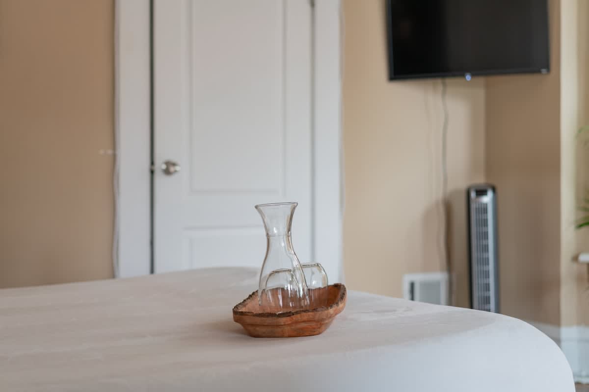 A symphony of textures—crisp linens, cloud-like pillows, and soft throws invite you to sink in and unwind.