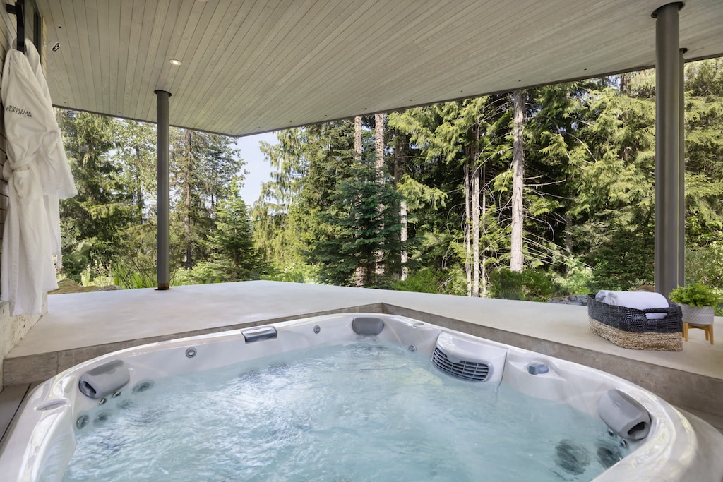 - Covered outdoor hot tub overlooking forest views  
- Relax in bubbling warmth surrounded by nature  
- A tranquil alpine escape for ultimate rejuvenation  
