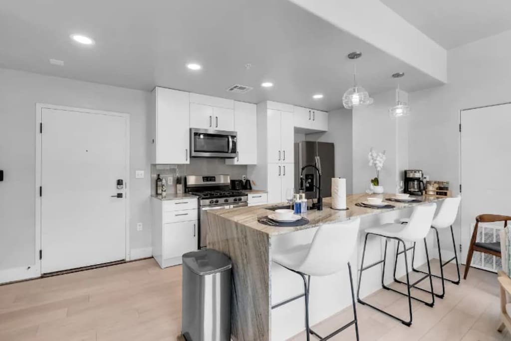 Fully stocked kitchen with bar seating for casual dining.