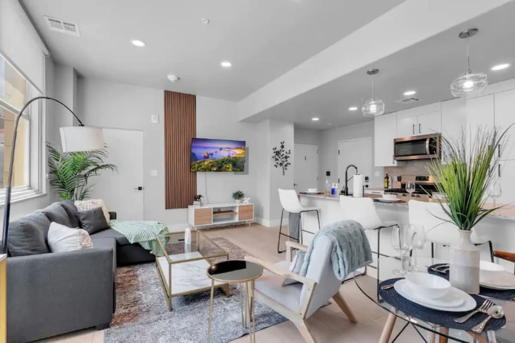 Relax in our inviting living room with a TV and plush sofa.