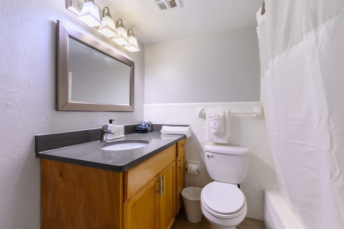 A beautifully crafted bathroom with sleek countertops, elegant lighting, and stylish details—your perfect peaceful escape