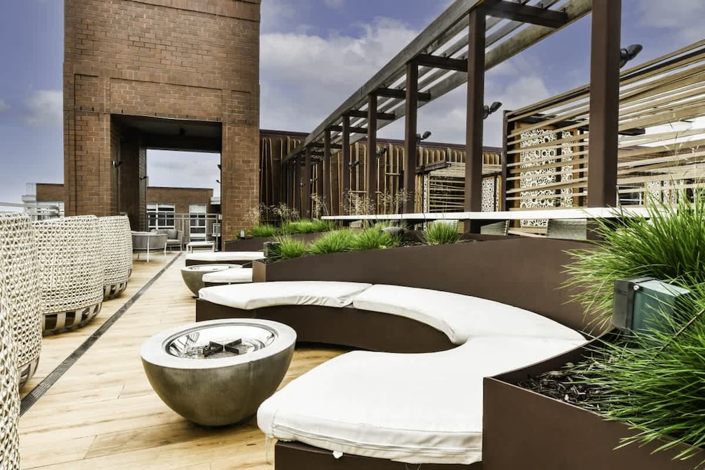 Social rooftop with scenic city view.