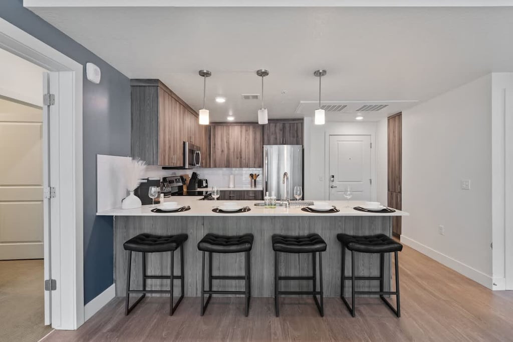 Wake up to fresh coffee in our kitchen,  stocked with utensils, a dishwasher, and an oven for all your culinary needs.