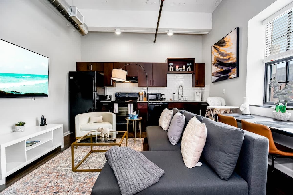 Comfortable sofa with TV and table