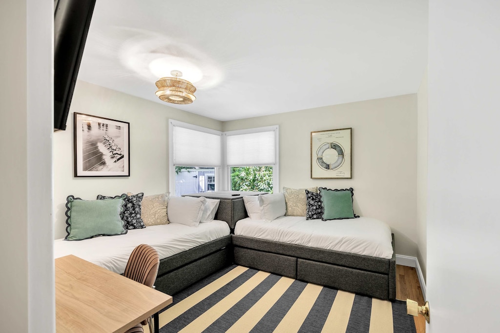 Twin bed guest room – featuring two corner beds, perfect for kids or extra guests.
