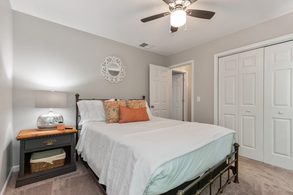 Upstairs queen bedroom at the end of the hall with 42 inch smart TV and closet.