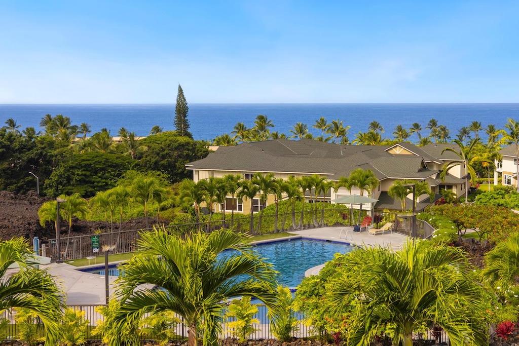 Enjoy the view of the pool and ocean from the lanai