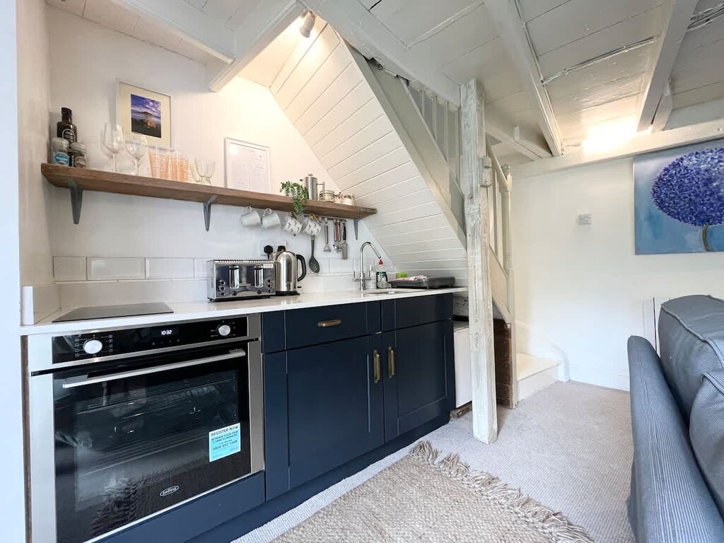 The kitchen area oven, toaster kettle and microwave available (fridge is a mini fridge without freezer)