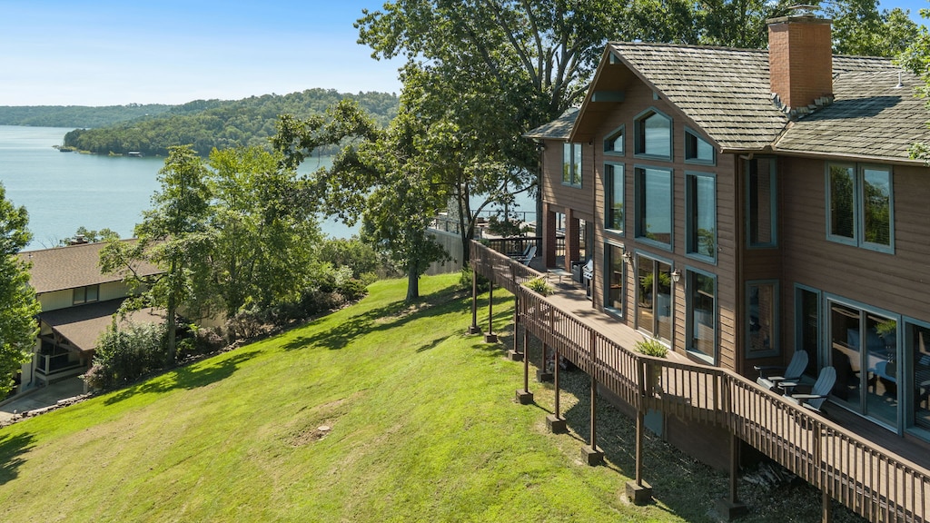 Our beautiful home, located on Beaver Lake, offers a serene view of the water from the huge patio or the comfort of the living room.