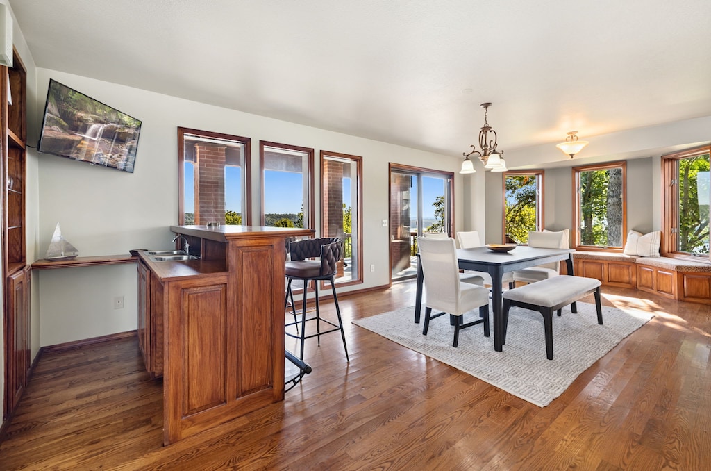 Dining table with seating for 6 along huge windows looking out onto the water!