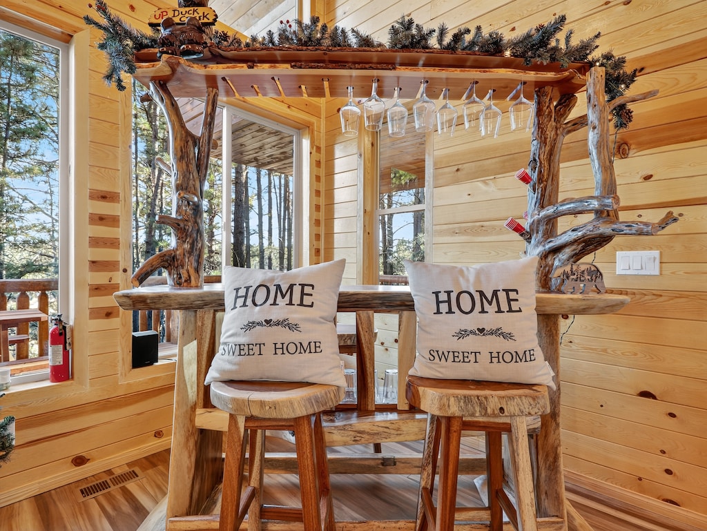 Warm wood interiors and handcrafted details create the perfect atmosphere for sipping morning coffee or evening wine at your private bar.