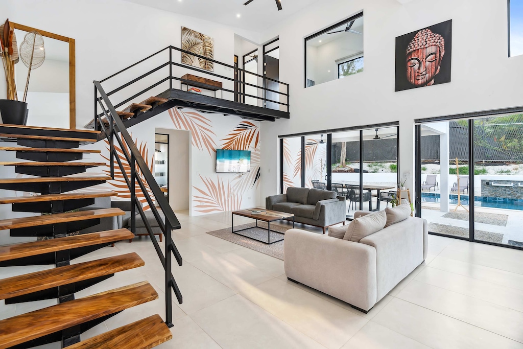 Sun-drenched spaces blend seamlessly with private poolside bliss.

