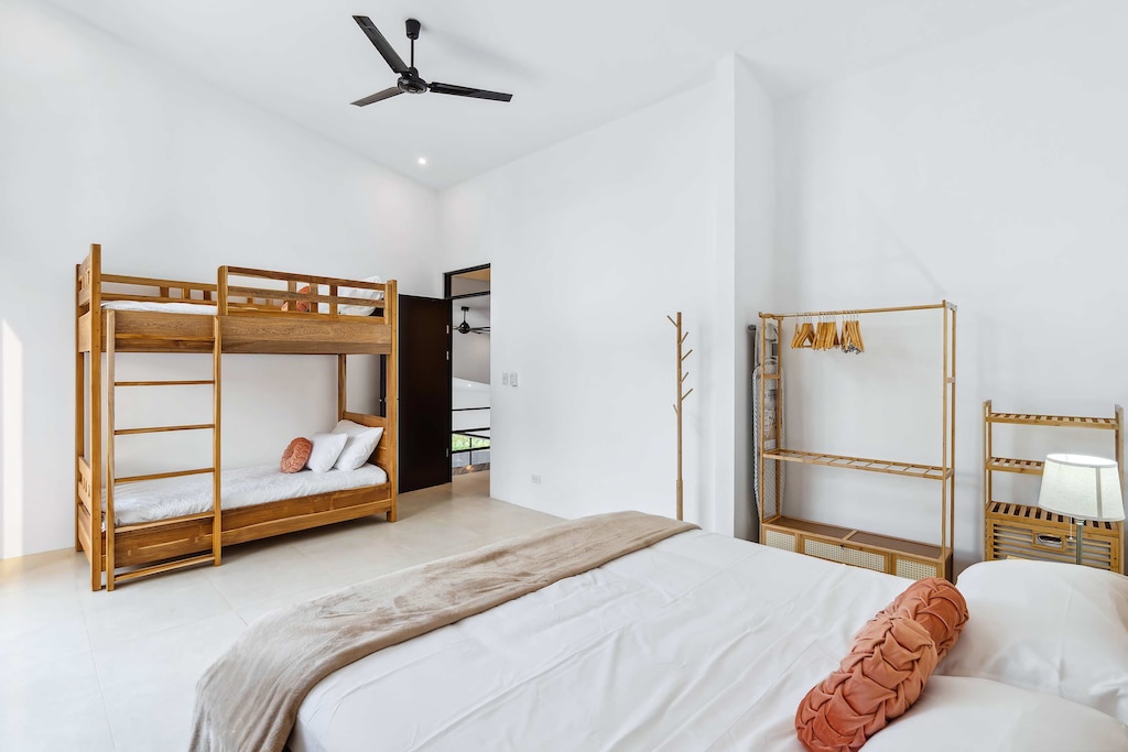 Share laughter and dreams in bright, airy slumber spaces.

