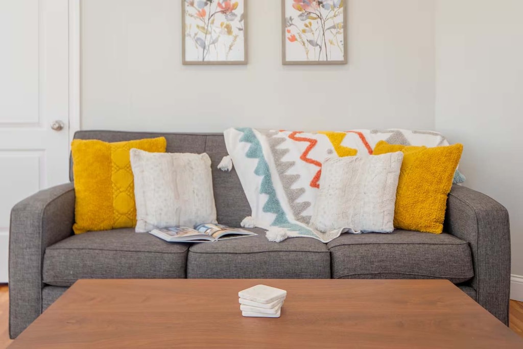 Living room couch is roomy enough for watching, reading, or just chilling!