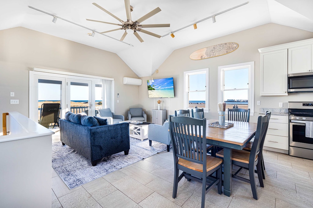 The top floor with 6 person dining table, ocean views, 65" smart TV, and AC!