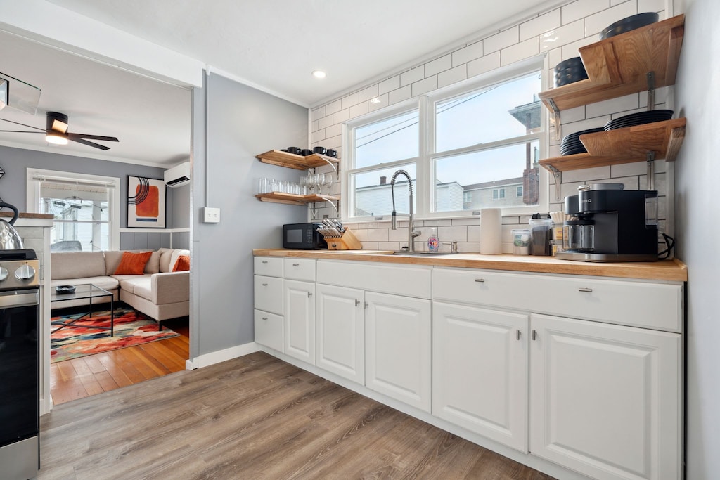 Full kitchen with coffee maker and microwave
