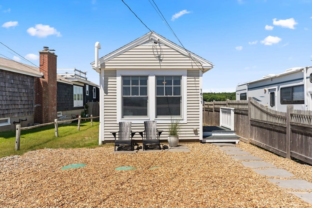 Front street view of property with parking for up to 5 vehicles